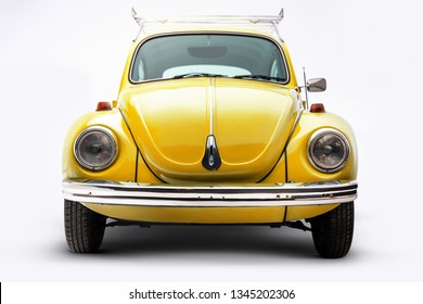 Izmir, Turkey - February 8, Front view of a yellow volkswagen beetle.