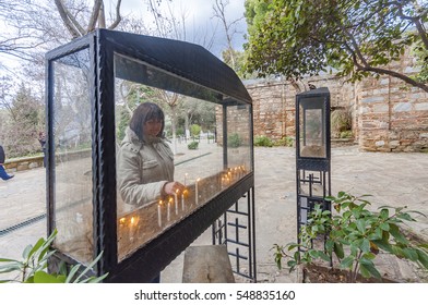 Izmir, Turkey - January 13, 2012 : People Are Visiting Virgin Mary's House. And Burning Candle. The House Of Virgin Mary Is Populer Tourist Attraction In Turkey.