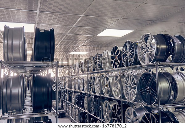 Izmir, Turkey ,\
January 14th. , 2020: The exposition of alloy wheels in an auto\
shop. People prefer to buy alloy wheels in original designs and\
make their car look\
different.