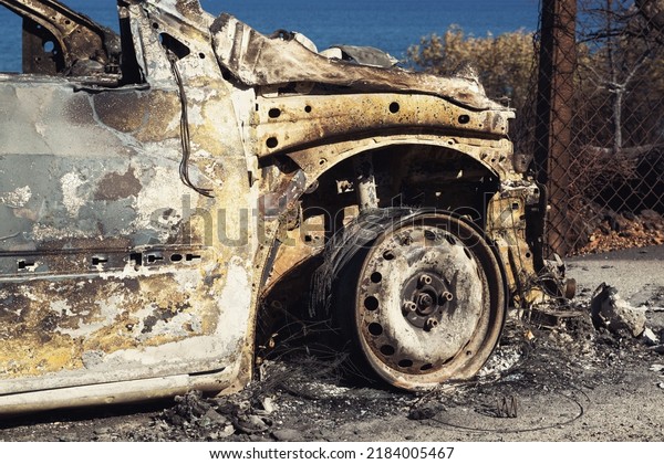 Izmir, Turkey - July 23, 2022: Close up shot of a\
Burnt car aftermath the forest fire at Derya Site Seferihisar Izmir\
Turkey.