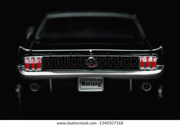 Izmir, Turkey -\
March 12, 2019. Ford Mustang 260 model car product shot. Back side\
view on a black\
background.