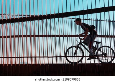 Izmir, Turkey, May 25, 2022; Handsome Young Man Riding His Bike On The Meles Bridge. Portrait Of Sports Man In Cycling Clothes. Active Sporty People Concept. Healthy Lifestyle. Cycling Silhouette.