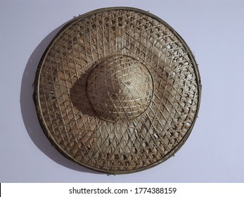The jaapi or japi is a traditional conical hat from Assam, India similar to the Asian conical hat which is made from tightly woven bamboo and/or cane and tokou paat a large.
