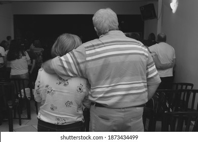 Jaboticabal, São Paulo, Brazil 02-22-2020: Older Couple Hugging On The Christian Church.