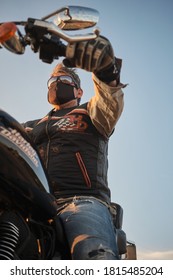 Jaca, Spain, September, 12, 2020: Harley Davidson Motorcycle Stopped In A Field At Sunset.