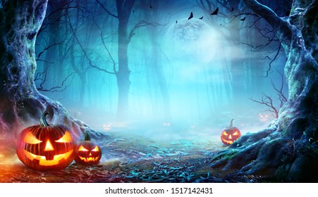 Jack O’ Lanterns In Spooky Forest At Moonlight - Halloween
				