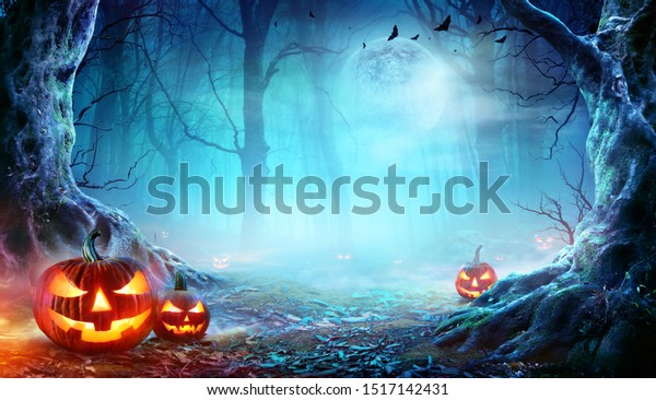 Jack O’ Lanterns In Spooky Forest At\
Moonlight - Halloween\
