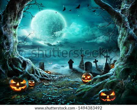 Jack 'O Lantern In Cemetery In Spooky Night With Full Moon - Halloween
