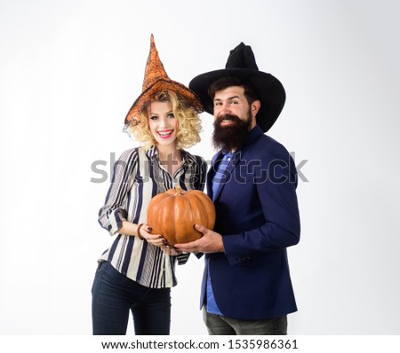 Jack o lantern. Preparation Halloween holidays. Happy couple dressed for Halloween party. Magic for Halloween. Celebration and party concept. 31 october. Halloween couple in witches hats with pumpkin.