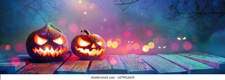  Jack O' Lanterns Glowing In Fantasy Night. Halloween Background