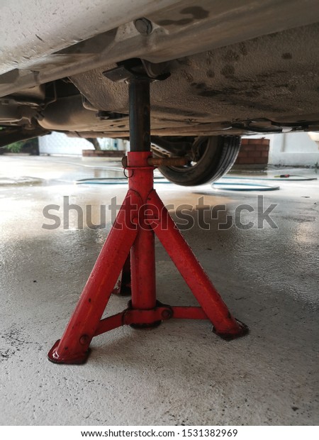 Jack stand\
for changing car wheels. safety\
measures