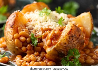 Jacket Baked potato with tomato beans, cheddar cheese. Traditional British food.