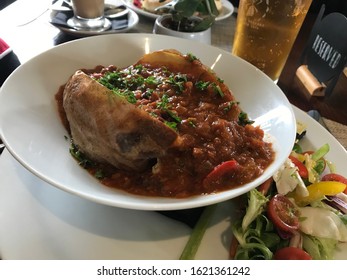 Jacket Potato With Beans And Cheese, Salad, And Beer For Lunch