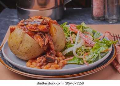 Jacket Potato Filled With Beans And Fish With Mixed Salad.