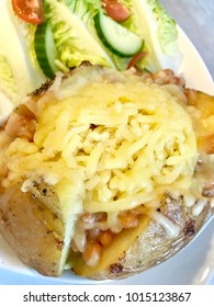 Jacket Potato With Grated Cheese And Baked Beans Served With Side Salad