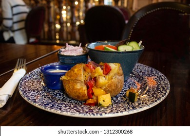 A Jacket Potato With Roast Vegetables, Coleslaw And Salad