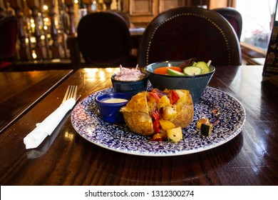 A Jacket Potato With Roast Vegetables, Coleslaw And Salad