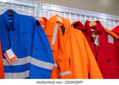 Jackets with reflective stripes - road workers special clothing. Workwear, protection clothing and outfit concept