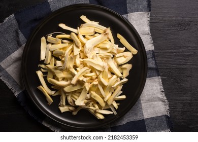 Jackfruit Flesh Pieces In A Black Plate, Placed On A Black Table Top, Tropical Health Beneficial Fruit Native To Southeast Asia, Taken From Above With Copy Space