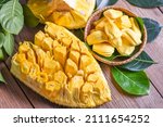 jackfruit on wooden basket with leaf, ripe jackfruit peeled tropical fruit fresh from jackfruit tree