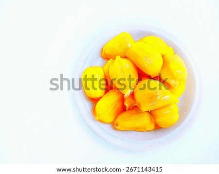 Jackfruit pulp.Close up top view of   jackfruit pulps in a plate on white background.The flesh of Jakfruit, jack tree fruit or named nangka photo.