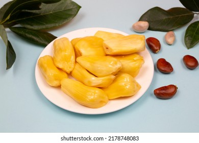 Jackfruit in white plate light blue background with seeds and leaves - Ripe jackfruit 
