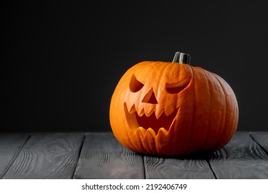 Jack-o-lantern on black background. Creepy pumpkin for Halloween. Halloween scary background.