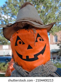 Jackolantern Pumpkin Face Scarecrow With Tree And Sky