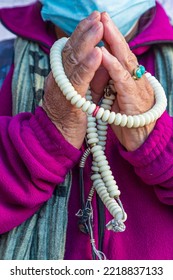 Jackson Heights, Queens, New York, USA. Woman Holding Prayer Beads.