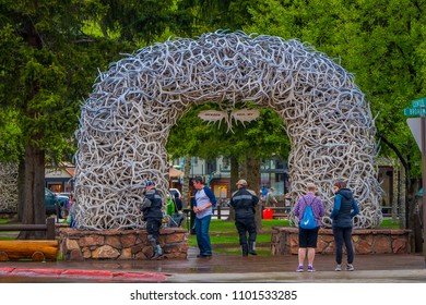 Jackson Hole, USA- May 23 2018: Large elk antler arches curve over Jackson Hole, Wyoming's square's, the antlers have been there since the early 1960s, and new arches are assembled to replace them