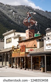 Jackson Hole, Wyoming / USA - April 4 2016: Famous Cowboy Bar in downtown Jackson Hole, with Teton mountains in the background