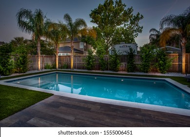 Jacksonville Beach, Florida / USA - November 9 2019: Backyard Of A Pool Home At Night