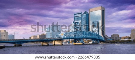 Jacksonville City Downtown Skyline and Buildings with dramatic winter storm cloudscape over John T. Alsop Jr. Bridge, the landmark lift bridge on Main Street over the St. Johns River in North Florida
