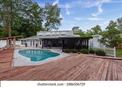 Jacksonville, Florida USA - January 3 2021: Inground pool in a backyard with a large deck