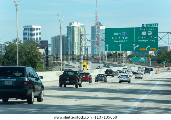 Jacksonville, FL/USA- 07/13/2018:\
Traffic flows towards downtown Jacksonville just after rush\
hour.