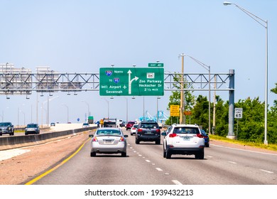 Jacksonville, USA - May 10, 2018: Florida interstate highway 295 with traffic road sign to i-95 international airport of Savannah and Zoo parkway with cars driving in summer
