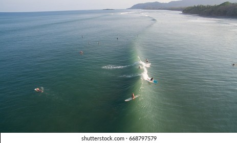 Jaco, Costa Rica - April 12, 2016: Aerial view of a surfer on a wave in Jaco, Costa Rica