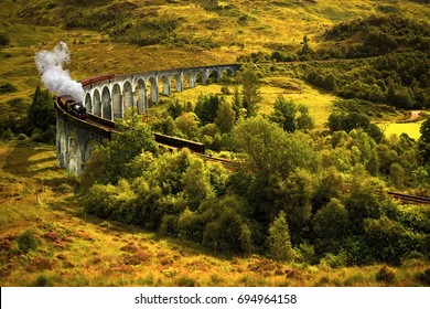 Jacobite Steam Train On Old Viaduct In Glenfinnan, Scotland