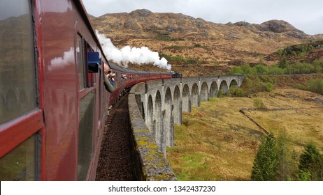 Jacobite Steam Train Passes Over The Glenfinnan Viaduct 