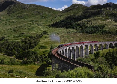 The Jacobite Train Passes Over The Glenfinnan Viaduct In Scotland