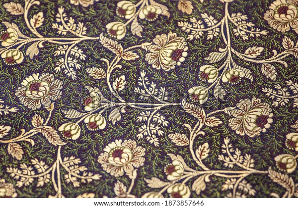 Jacquard fabric, floral motif.\
Close-up of elegant and splendid silk fabric with a floral\
ornament. 
