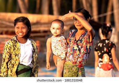 Jade Taw Fishing Village, Thandwe District, Rakhine State, Myanmar, 03-21-2020, 3 Generation Of Women  Watching Their Men Sailing Into The Sunset. The Fishing Here Is Done At Night.