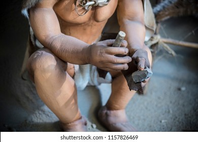 Jaen, Spain - December 29th, 2017: Life-sized Sculpture Of Prehistoric Man Creating Lithic Tool At Jaen Museum