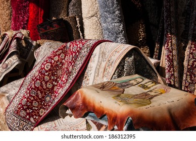 JAFFA, ISRAEL - FEBRUARY 18, 2014: Oriental Carpets And A Rug With Portraits Of  Prophet Moses (Moshe Rabbenu) And His Brother Aaron (first High Priest) Besides The Tablets Of Law At The Flea Market .