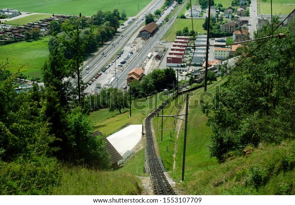 \
\
Jagged\
rails leading to mount Pilatus in Lucerne, Switzerland. Bird\'s eye\
view of the railway station and car\
Park.