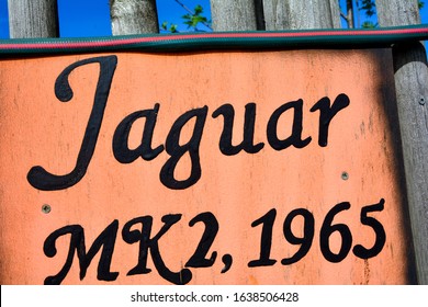 Jaguar MK 2 1965 lettering on colored plate - Powered by Shutterstock