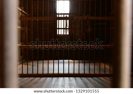 Jail  Prison Grille room punishment vintage wooden and metal bars.