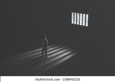 jail window light in a completely dark prison cell illuminated guilty man