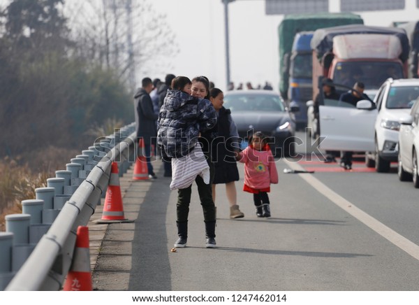 JAINGXI CHINA-February 12, 2018: China Spring\
Festival Transport, foggy weather led to high-speed closure, Hubei\
Jiangxi junction high-speed, causing serious traffic congestion for\
several kilometers.