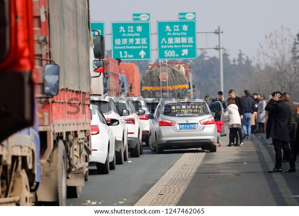 JAINGXI CHINA-February 12, 2018: China Spring\
Festival Transport, foggy weather led to high-speed closure, Hubei\
Jiangxi junction high-speed, causing serious traffic congestion for\
several kilometers.